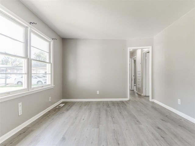3320 NE 14th St, Oklahoma City, OK 73117 - spare room with light wood-style flooring and baseboards
