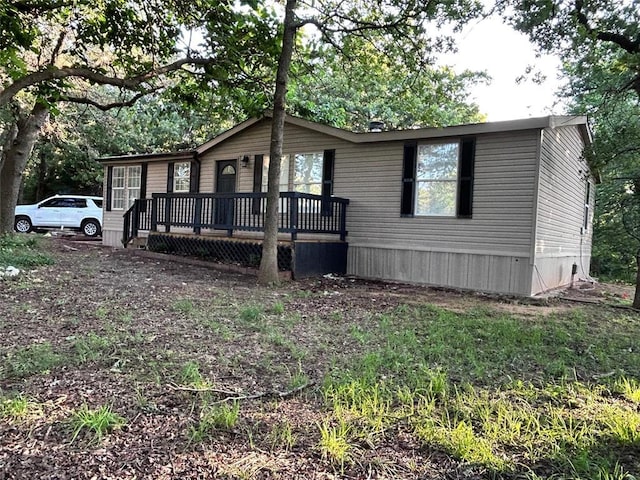 13001 Fox Pass Rd, Edmond, OK 73034 - manufactured / mobile home with a wooden deck