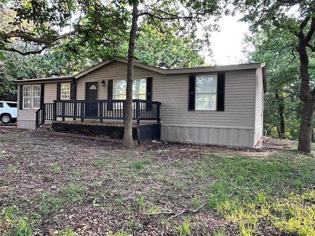 13001 Fox Pass Rd, Edmond, OK 73034 - manufactured / mobile home with a wooden deck