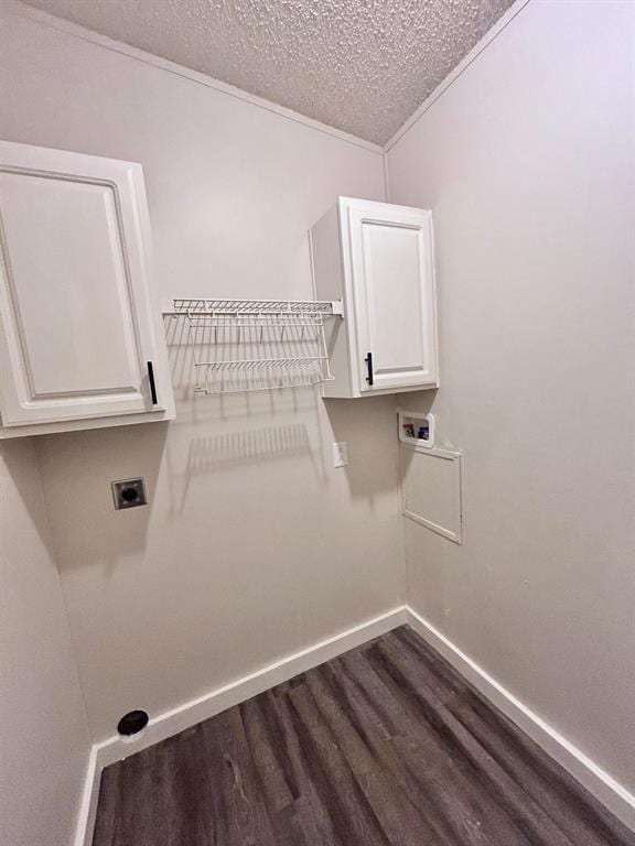 13001 Fox Pass Rd, Edmond, OK 73034 - washroom featuring cabinet space, dark wood-type flooring, a textured ceiling, electric dryer hookup, and hookup for a washing machine