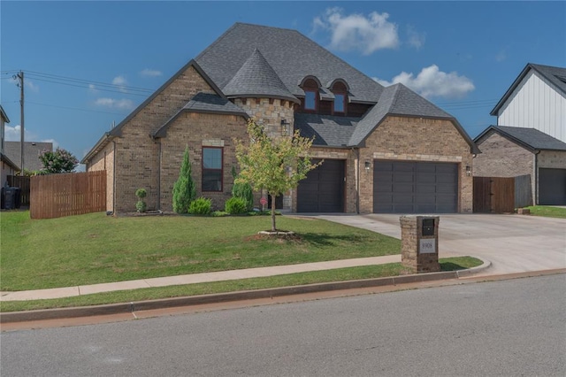 8908 NW 130th St, Oklahoma City, OK 73142 - french provincial home featuring brick siding, driveway, and an attached garage