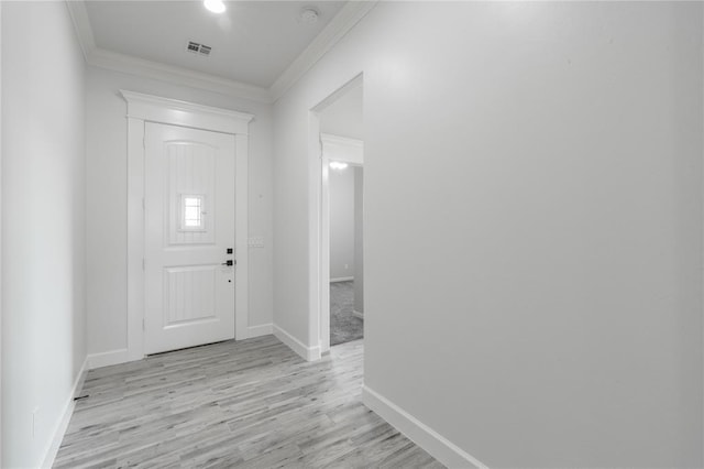8908 NW 130th St, Oklahoma City, OK 73142 - foyer entrance featuring ornamental molding and light wood-type flooring