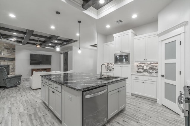 8908 NW 130th St, Oklahoma City, OK 73142 - kitchen with stainless steel appliances, coffered ceiling, light wood-type flooring, tasteful backsplash, and recessed lighting