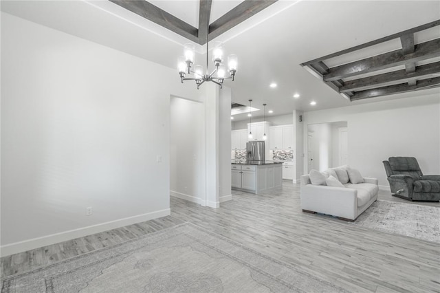 8908 NW 130th St, Oklahoma City, OK 73142 - living room with recessed lighting, light wood-type flooring, and a chandelier