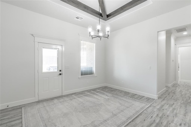 8908 NW 130th St, Oklahoma City, OK 73142 - unfurnished dining area with a chandelier and light wood-style flooring