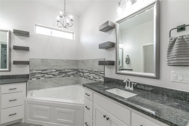 8908 NW 130th St, Oklahoma City, OK 73142 - full bathroom featuring a jetted tub, vanity, and a chandelier