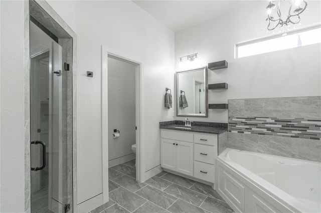 8908 NW 130th St, Oklahoma City, OK 73142 - full bath with a garden tub, vanity, a shower stall, marble look tile flooring, and a chandelier
