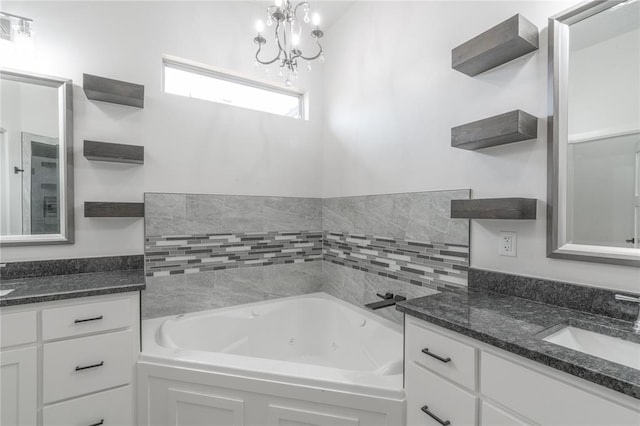8908 NW 130th St, Oklahoma City, OK 73142 - bathroom with vanity, a tub with jets, and a chandelier