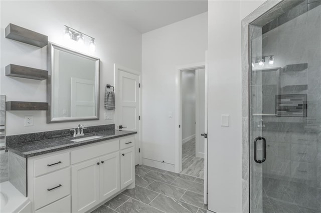 8908 NW 130th St, Oklahoma City, OK 73142 - full bathroom with a shower stall, vanity, marble finish flooring, and a bath