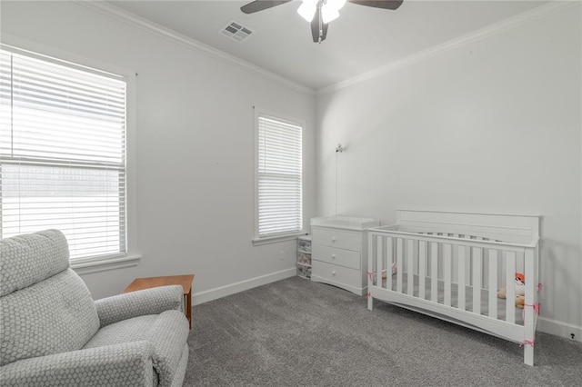 8908 NW 130th St, Oklahoma City, OK 73142 - bedroom with carpet floors, crown molding, ceiling fan, and a crib