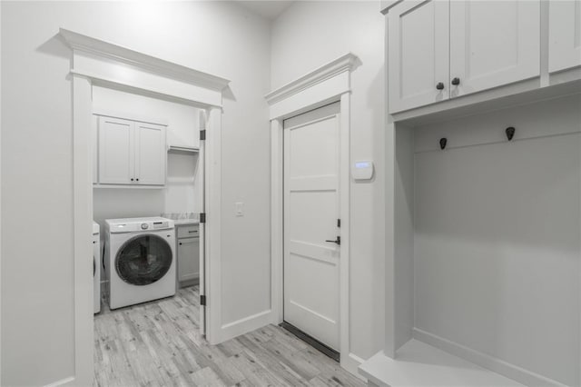 8908 NW 130th St, Oklahoma City, OK 73142 - laundry room featuring cabinet space and light wood-type flooring