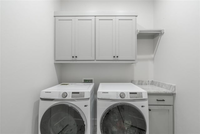 8908 NW 130th St, Oklahoma City, OK 73142 - laundry area featuring separate washer and dryer and cabinet space