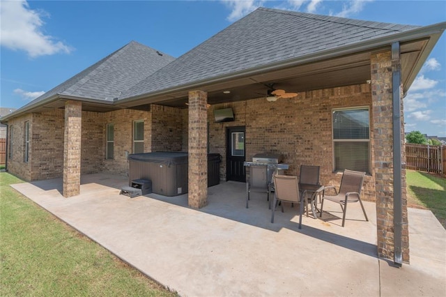8908 NW 130th St, Oklahoma City, OK 73142 - view of patio / terrace featuring a hot tub, a ceiling fan, grilling area, and outdoor dining space