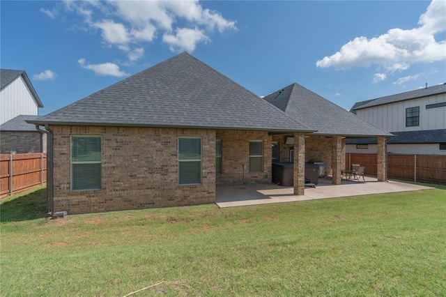 8908 NW 130th St, Oklahoma City, OK 73142 - rear view of house featuring a shingled roof, a patio, and brick siding