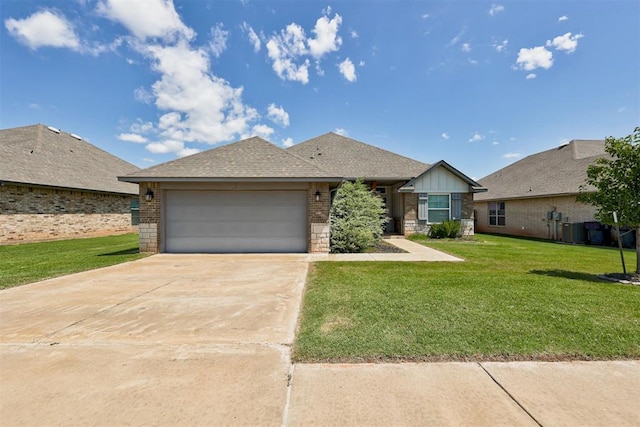 4213 NW 155th St, Edmond, OK 73013 - view of front of house with a garage, a front yard, brick siding, and driveway