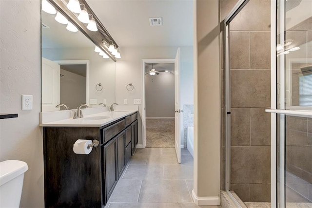 4213 NW 155th St, Edmond, OK 73013 - bathroom with a ceiling fan, double vanity, a stall shower, and tile patterned flooring