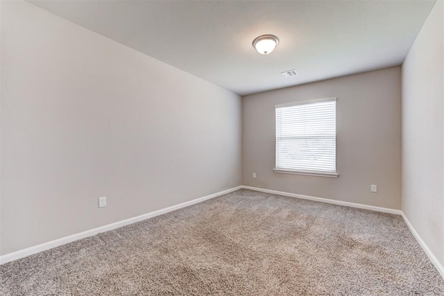 4213 NW 155th St, Edmond, OK 73013 - carpeted spare room featuring baseboards