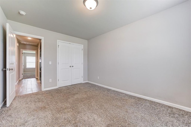 4213 NW 155th St, Edmond, OK 73013 - unfurnished bedroom featuring light carpet, a closet, and attic access