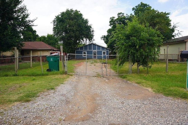 3309 SW 27th St, Oklahoma City, OK 73108 - view of dirt / gravel road featuring a gate and a gated entry
