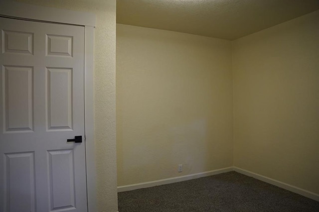 3309 SW 27th St, Oklahoma City, OK 73108 - spare room featuring dark carpet and baseboards