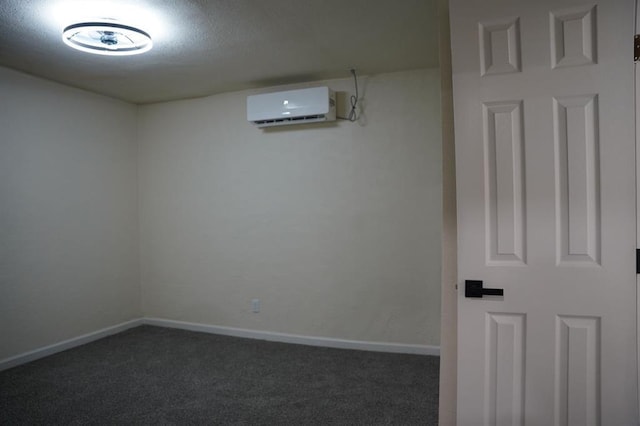 3309 SW 27th St, Oklahoma City, OK 73108 - unfurnished room featuring an AC wall unit, dark colored carpet, and a textured ceiling