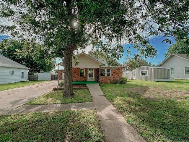 309 N Spencer Ave, Hinton, OK 73047 - view of front of property featuring brick siding and driveway