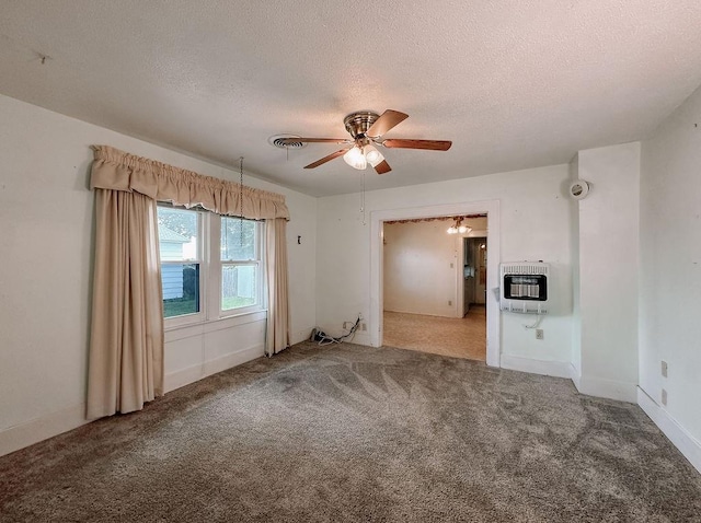 309 N Spencer Ave, Hinton, OK 73047 - spare room featuring heating unit, a ceiling fan, a textured ceiling, carpet, and a smoke detector