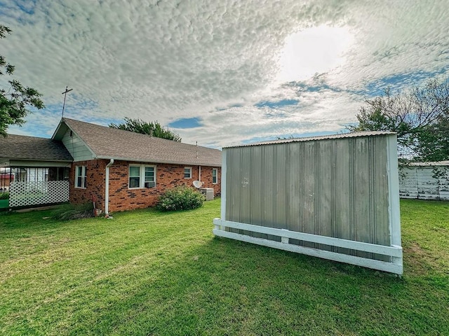 309 N Spencer Ave, Hinton, OK 73047 - view of grassy yard with a storage unit