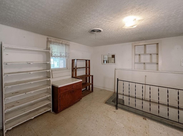 309 N Spencer Ave, Hinton, OK 73047 - bedroom featuring light flooring and a textured ceiling