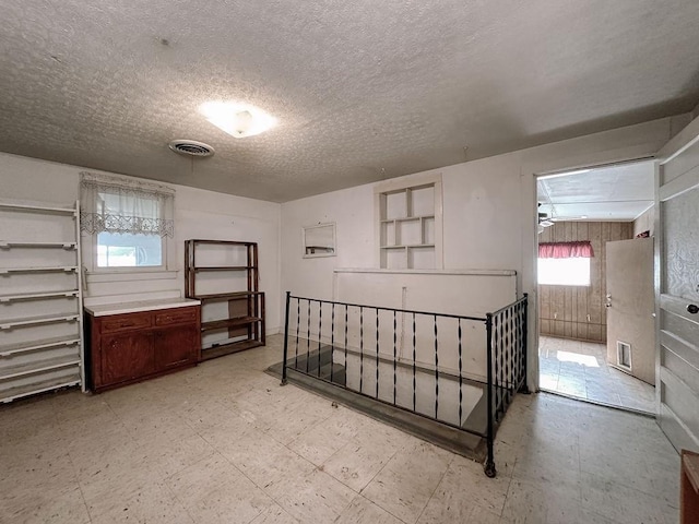 309 N Spencer Ave, Hinton, OK 73047 - interior space featuring light floors and a textured ceiling