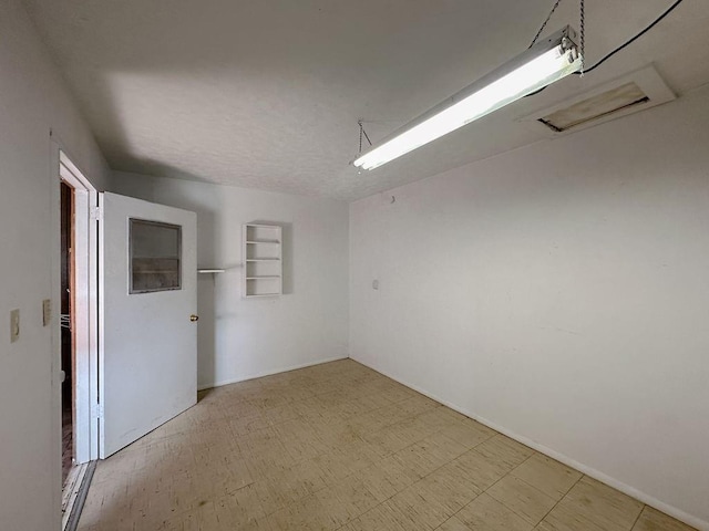 309 N Spencer Ave, Hinton, OK 73047 - spare room featuring tile patterned floors