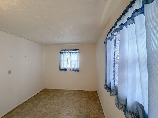 309 N Spencer Ave, Hinton, OK 73047 - unfurnished room with baseboards