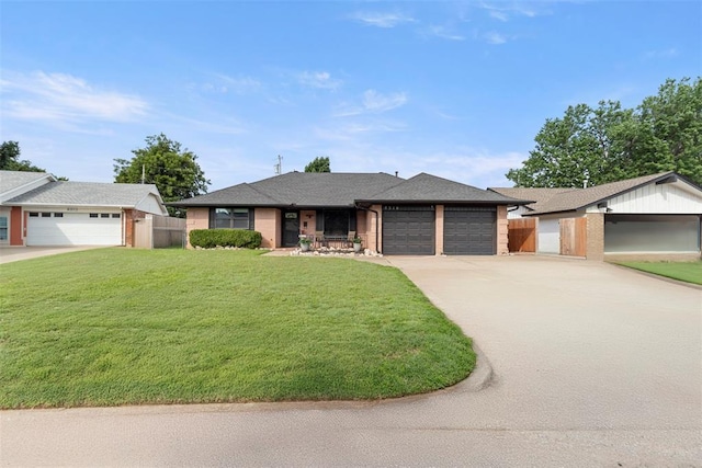 8316 NW 39th St, Bethany, OK 73008 - ranch-style house featuring a garage, driveway, and brick siding