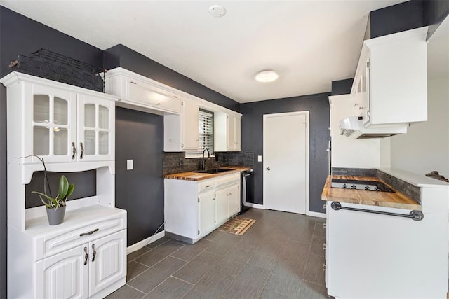 8316 NW 39th St, Bethany, OK 73008 - kitchen featuring tasteful backsplash, black electric stovetop, white cabinetry, dishwasher, and custom range hood