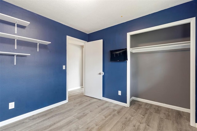 8316 NW 39th St, Bethany, OK 73008 - unfurnished bedroom featuring wood finished floors and a closet