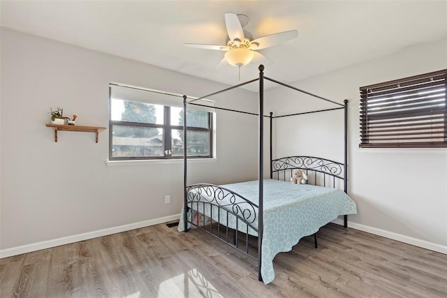 8316 NW 39th St, Bethany, OK 73008 - bedroom with wood finished floors and a ceiling fan