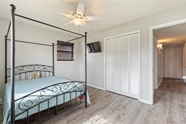 8316 NW 39th St, Bethany, OK 73008 - bedroom featuring wood finished floors, a closet, and ceiling fan