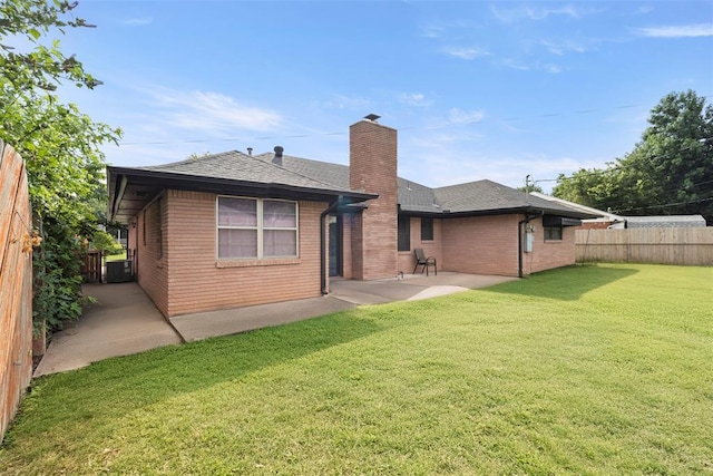 8316 NW 39th St, Bethany, OK 73008 - back of house with a patio, brick siding, a fenced backyard, and a chimney