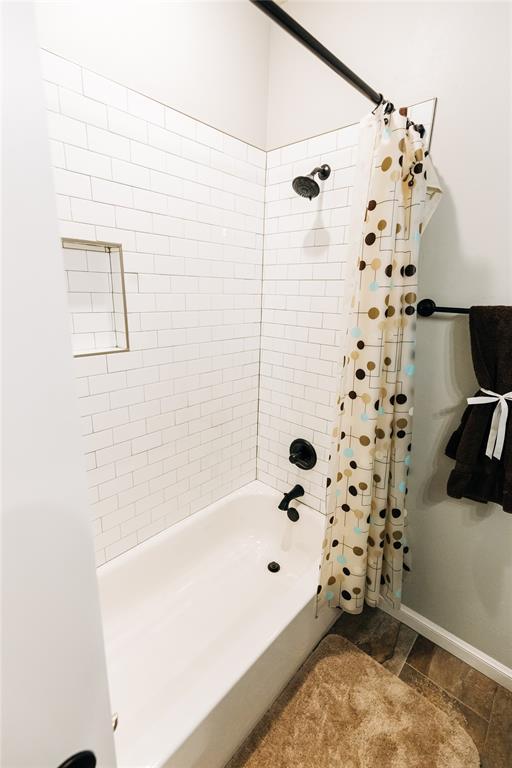 11501 SW 56th St, Mustang, OK 73064 - full bathroom with shower / tub combo with curtain