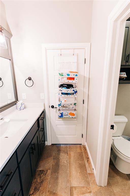 11501 SW 56th St, Mustang, OK 73064 - bathroom with vanity and toilet
