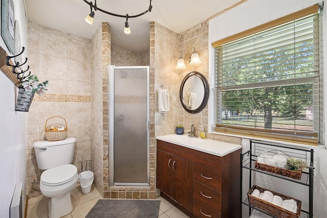 213 Meadowlark Ln, Fort Cobb, OK 73038 - full bath with tile walls, tile patterned flooring, vanity, a shower stall, and a baseboard heating unit