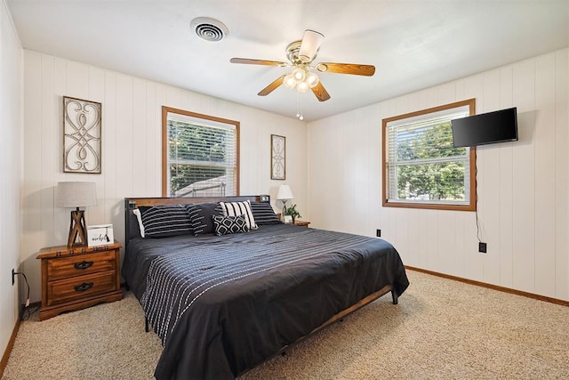 213 Meadowlark Ln, Fort Cobb, OK 73038 - bedroom with multiple windows, carpet, and ceiling fan
