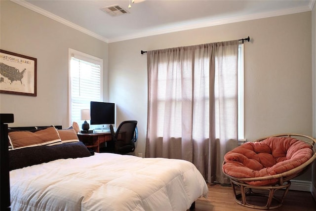 2629 Cashion Pl, Oklahoma City, OK 73112 - bedroom featuring wood finished floors, crown molding, and a desk