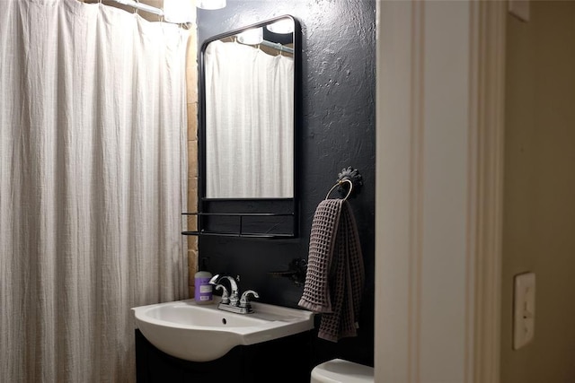 2629 Cashion Pl, Oklahoma City, OK 73112 - full bathroom with vanity and a textured wall