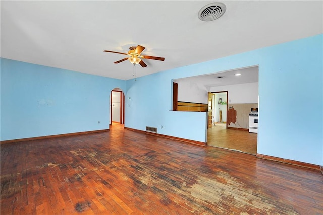 105 E E Walk, Canute, OK 73626 - unfurnished living room with ceiling fan, hardwood / wood-style flooring, and arched walkways