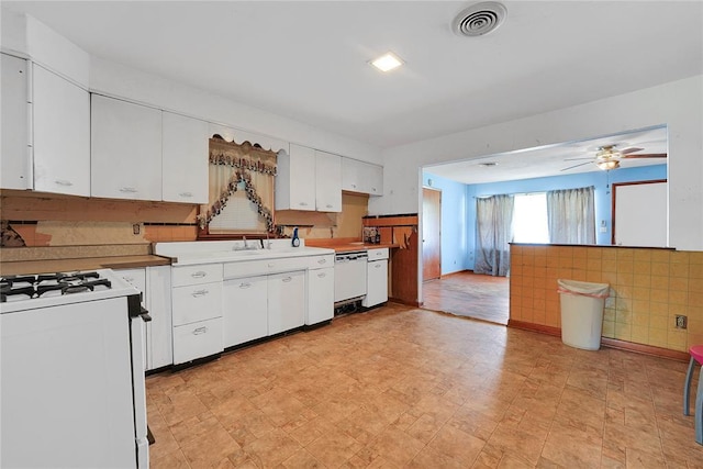 105 E E Walk, Canute, OK 73626 - kitchen with white appliances, white cabinets, light floors, a ceiling fan, and light countertops