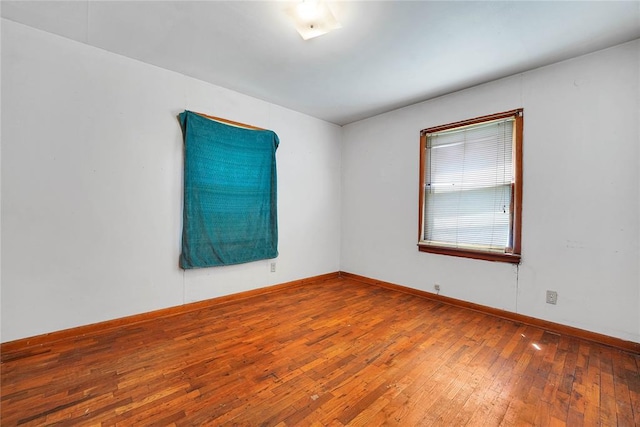 105 E E Walk, Canute, OK 73626 - spare room featuring hardwood / wood-style flooring and baseboards