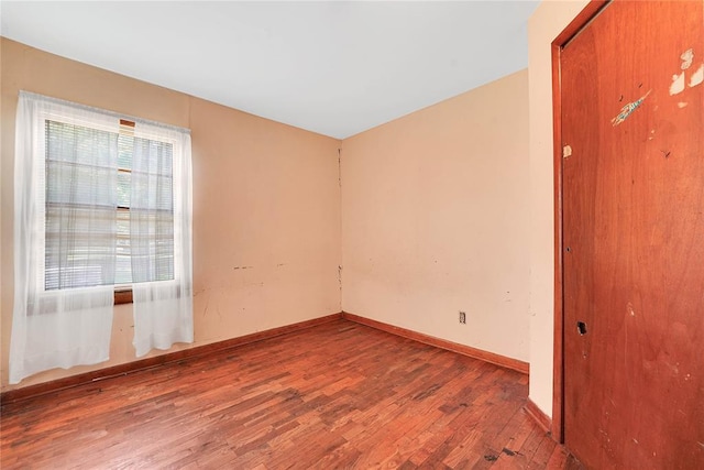 105 E E Walk, Canute, OK 73626 - unfurnished room with wood finished floors and baseboards