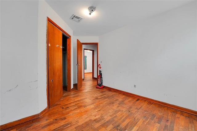 105 E E Walk, Canute, OK 73626 - spare room featuring wood finished floors and baseboards