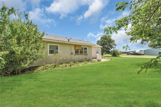 105 E E Walk, Canute, OK 73626 - back of house featuring a lawn